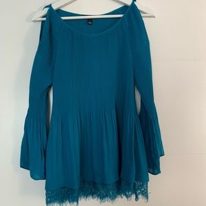 Turquoise slit sleeve blouse.